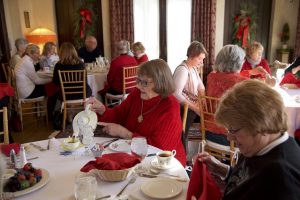 Guest enjoy the holidays with a tea service in the Kellogg Manor House