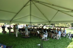 Battle Creek Cereal City Band performs under tent at Lakeside Concert