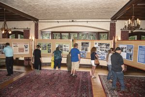 Visitors enjoy WWII displays in the Manor House living room