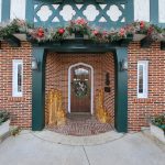 Exterior front door of the W.K.Kellogg Manor House with holiday decorations